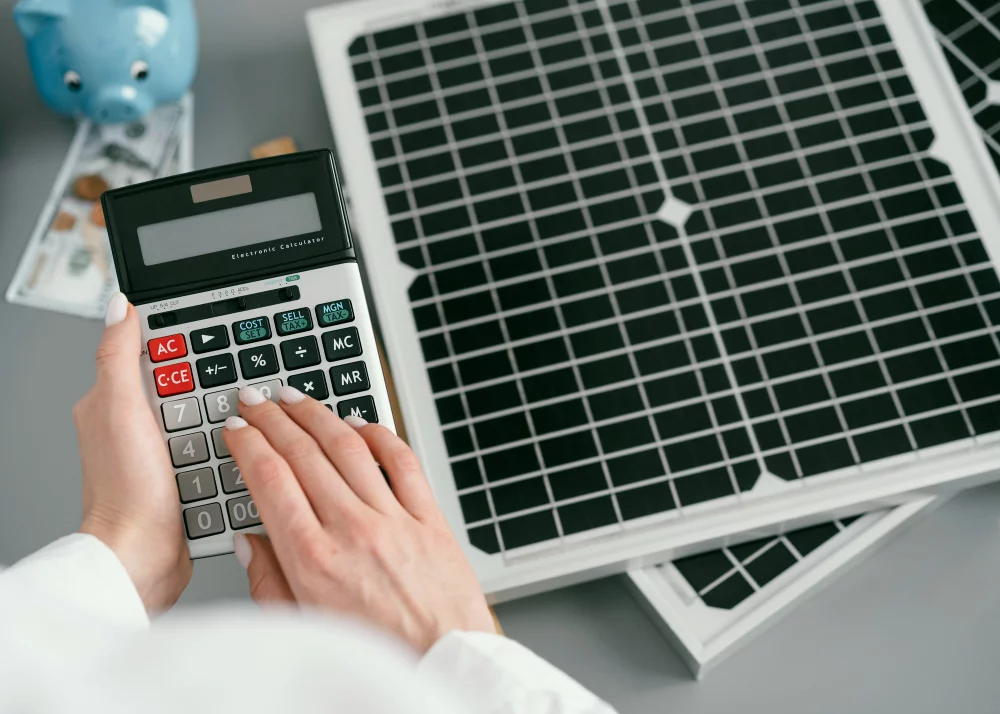close up hand typing calculator
