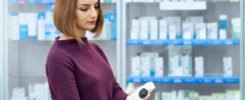 female customer choosing medical products drugstore